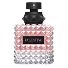 Valentino Donna Born In Roma EDP парфюмна вода за жени, елегантен флакон с цветен дизайн и златни детайли.
