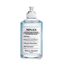 Унисекс парфюм Maison Margiela Replica Sailing Day EDT с морски нотки и свеж аромат, показан в елегантна бутилка.