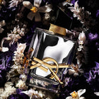 Дамски парфюм Saint Laurent Libre Absolu Platine EDP, елегантна бутилка и ароматна композиция на фона.