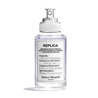 Унисекс парфюм Maison Margiela Replica When The Rain Stops EDT с бутилка и капак, изразяващ свежест и чистота
