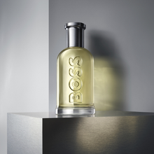 Hugo Boss Boss Bottled EDT парфюм за жени, бутилка с елегантен дизайн и ароматна нотка, показана на изображението.