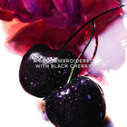 Guerlain La Petite Robe Noire EDP парфюмна вода за жени, бутилка с елегантен дизайн и черен капак, за свеж и женствен аромат