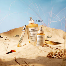 Унисекс парфюм Maison Margiela Replica Beach Walk EDT със свеж аромат и елегантен дизайн, показан в изображението.