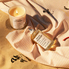 Унисекс парфюм Maison Margiela Replica Beach Walk EDT с изображение на бутилка и ароматни нотки.