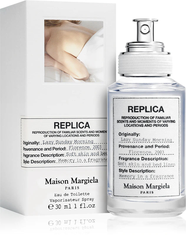 Унисекс парфюм Maison Margiela Replica Lazy Sunday Morning EDT с прозрачна бутилка и елегантен дизайн.