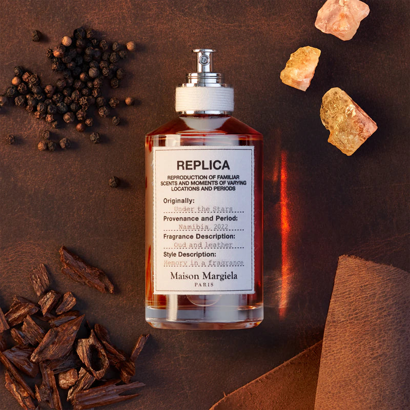 Унисекс парфюм Maison Margiela Replica Under The Stars EDT, бутилка с елегантен дизайн и ароматни нотки на нощното небе.
