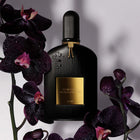 Дамски и мъжки парфюм Tom Ford Black Orchid EDP в черна бутилка с орхидеи и златисти акценти.